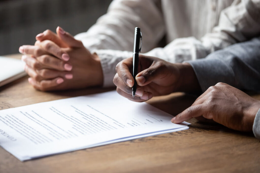An attorney working on a civil litigation case with his client in Southern Maryland and Waldorf.